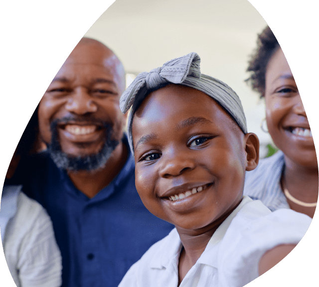 Selfie of a black family interested in healthy lifestyle services sitting together in their kitchen